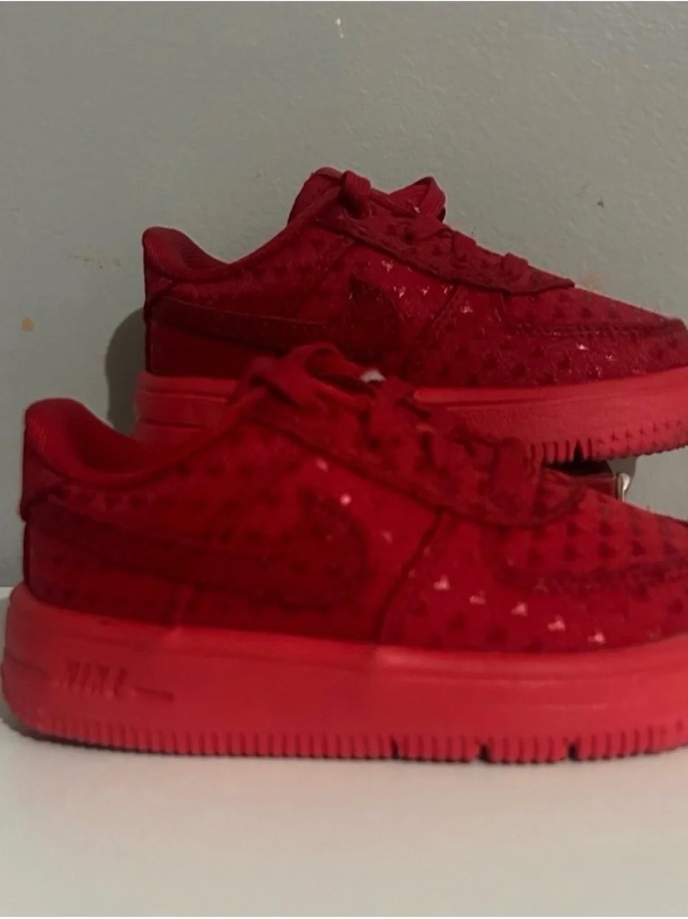 Nike Kids Red Low-Top Sneakers with Subtle Pattern